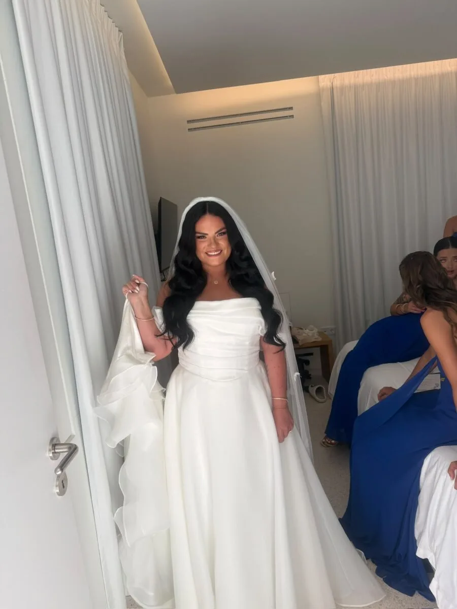 Bride in full gown and veil, radiant smile