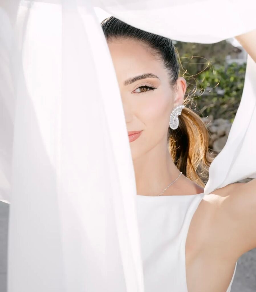 Editorial beauty portrait through flowing veil