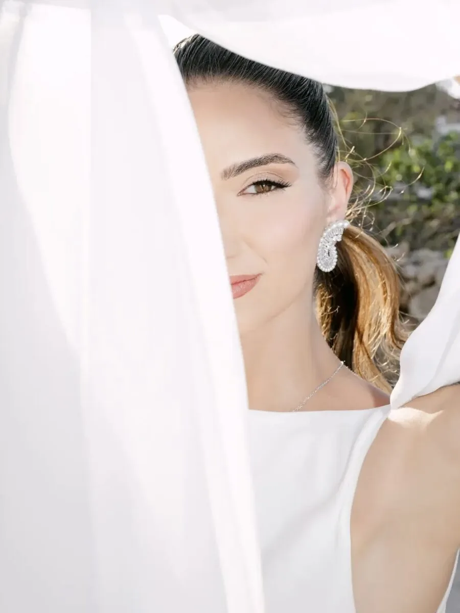 Editorial beauty portrait through flowing veil